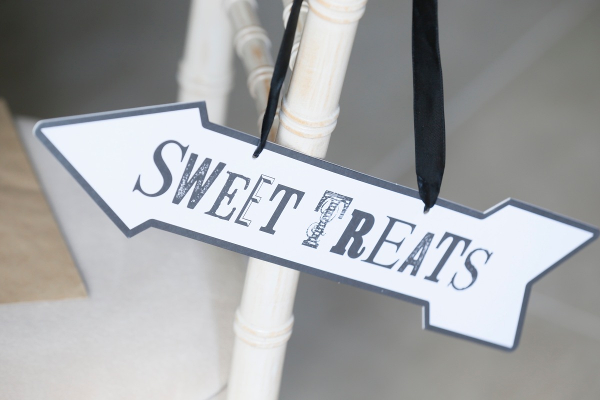 Sweet treats wedding sign pointing left - planning a wedding in France